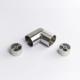 A flexible Stainless Steel metal tube connector positioned between two silver circular mounting inserts 43mm