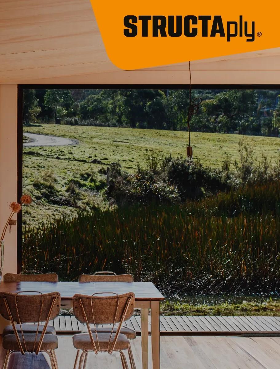 STRUCTAply wall panels in a dining area overlooking a grassy landscape