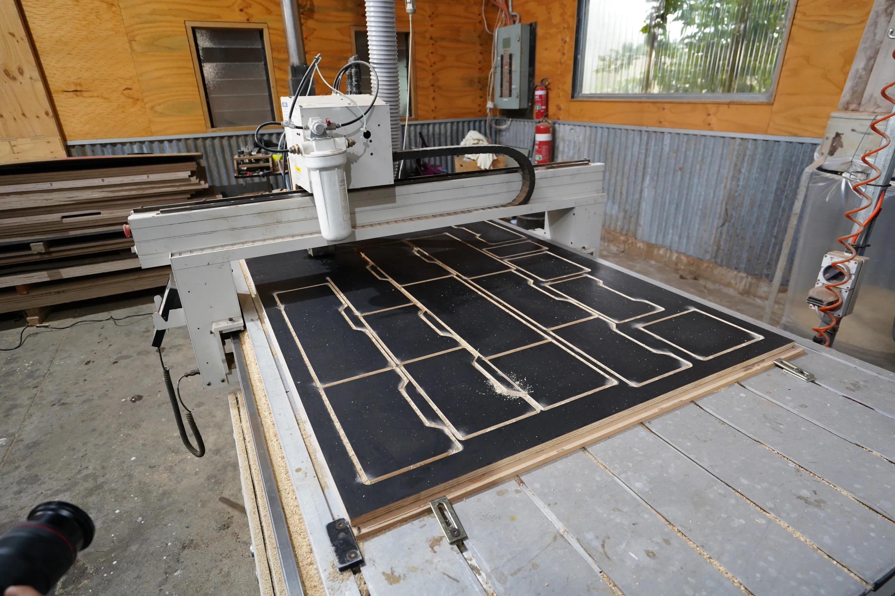 CNC router cutting STRUCTAply panels in a workshop