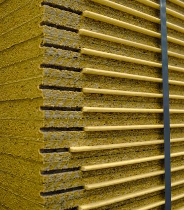 Wooden panels in a room with corrugated roofing