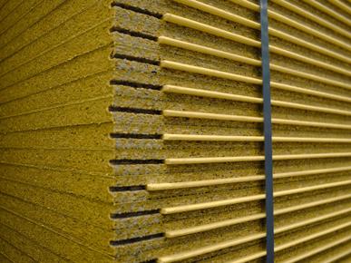 Wooden panels in a room with corrugated roofing