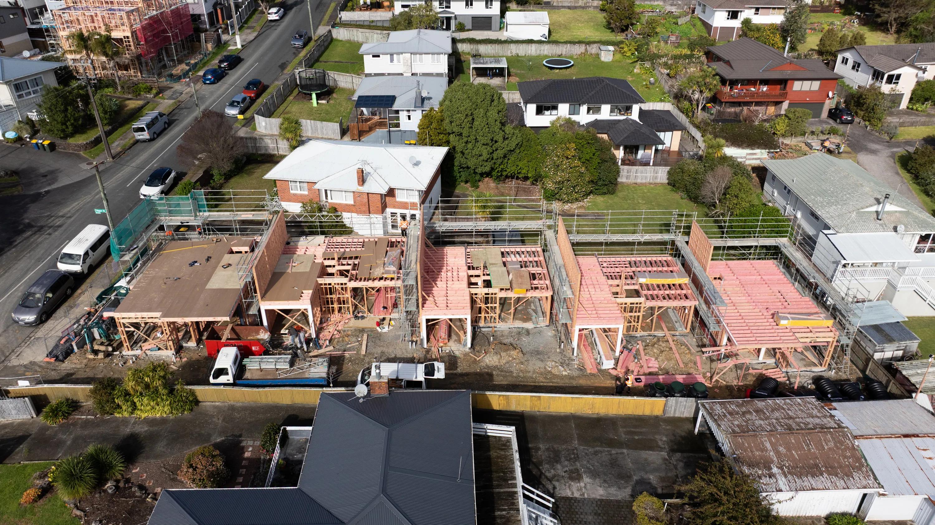 Aerial view of residential homes under construction in an urban neighbourhood