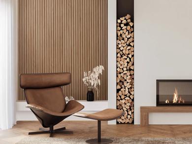 Large room featuring modern furniture. A wooden bench against a wall, two sofas in a living area, a fireplace, and a large window. The color scheme includes shades of brown and white with a touch of black for accents