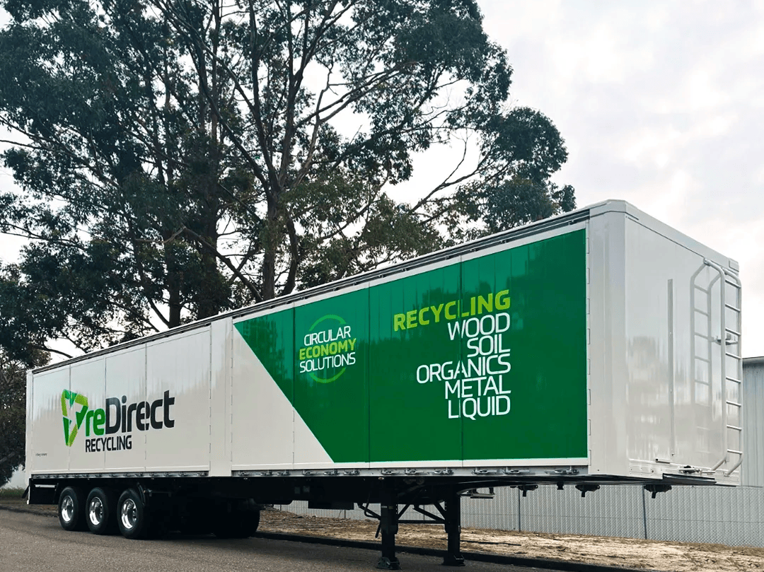 reDirect Recycling walking floor trailer with circular economy branding.
