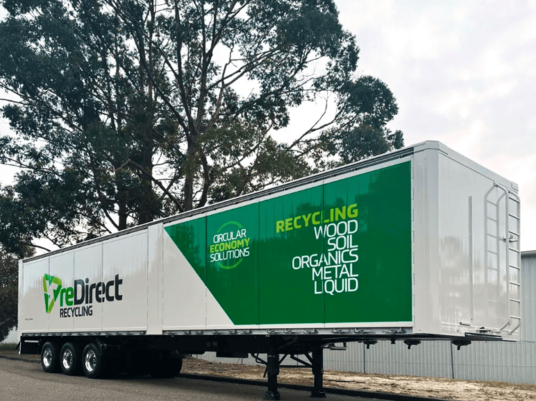 reDirect Recycling walking floor trailer with circular economy branding.