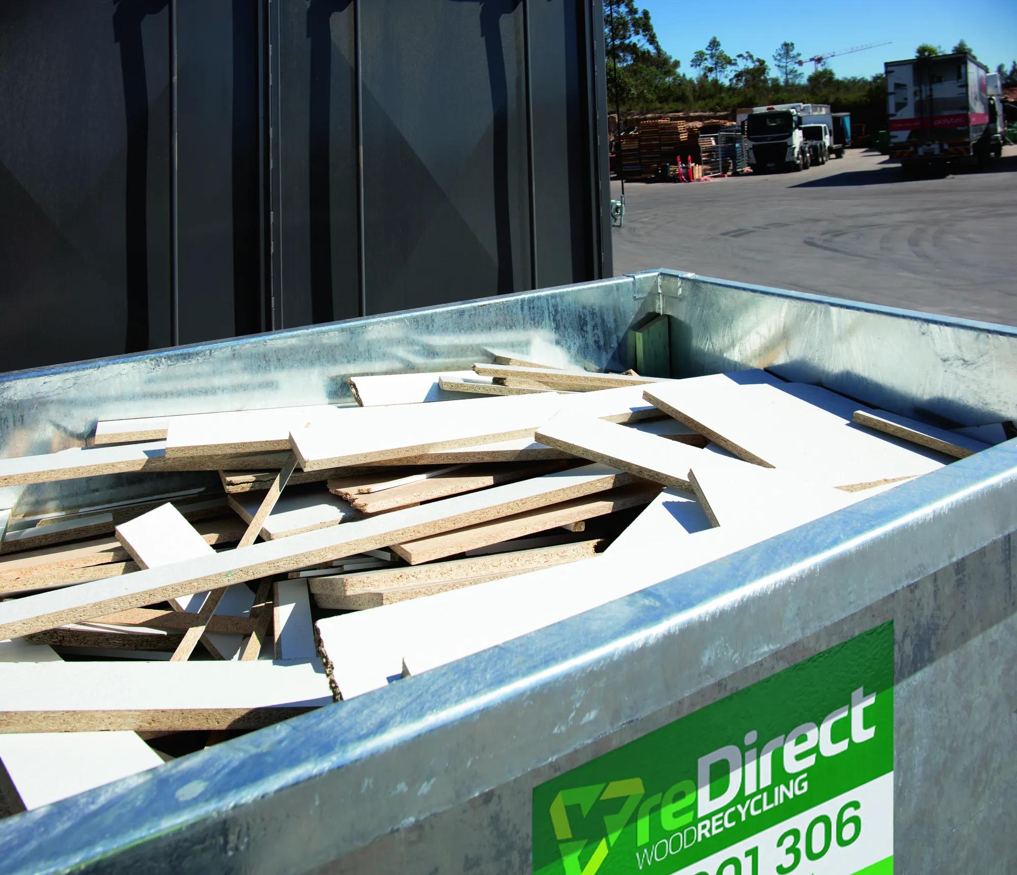 reDirect Wood Recycling skip bin filled with timber waste at site.
