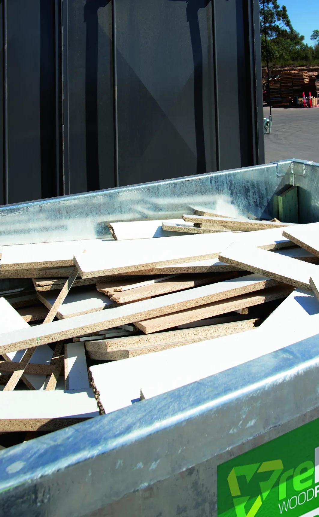reDirect Wood Recycling skip bin filled with timber waste at site.