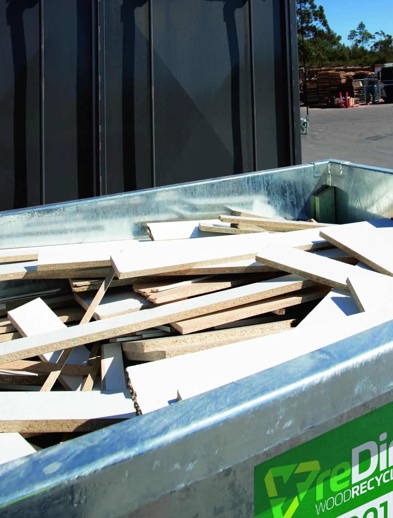 reDirect Wood Recycling skip bin filled with timber waste at site.