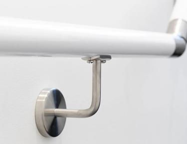 Metal handle on white railing