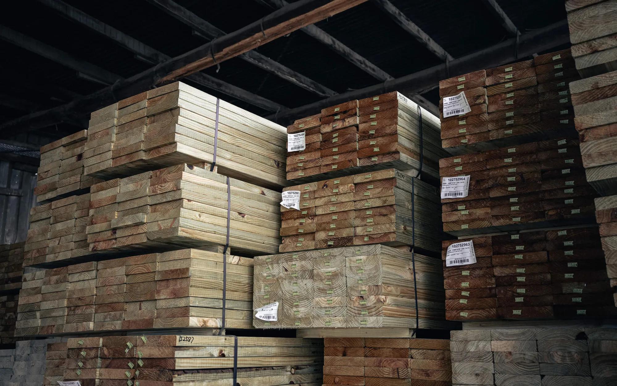 A storage facility with stacks of timber