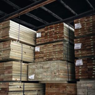 A storage facility with stacks of timber