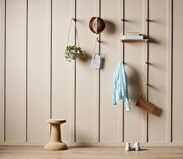 A styled wall made with Dressed board and dowels