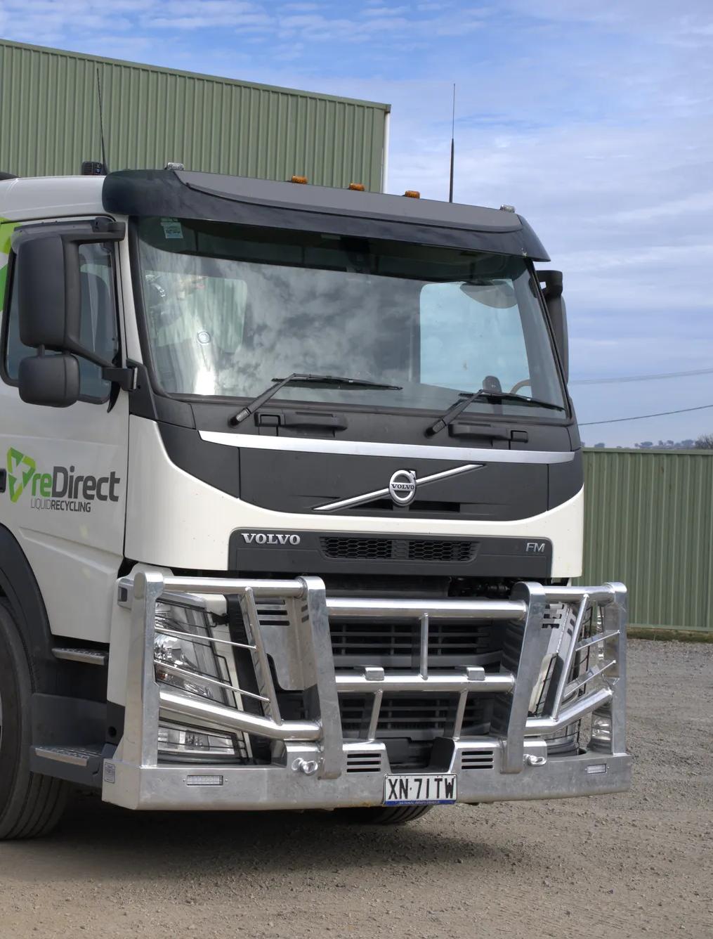 reDirect Liquid Recycling Volvo tanker truck front-angle view in open yard.