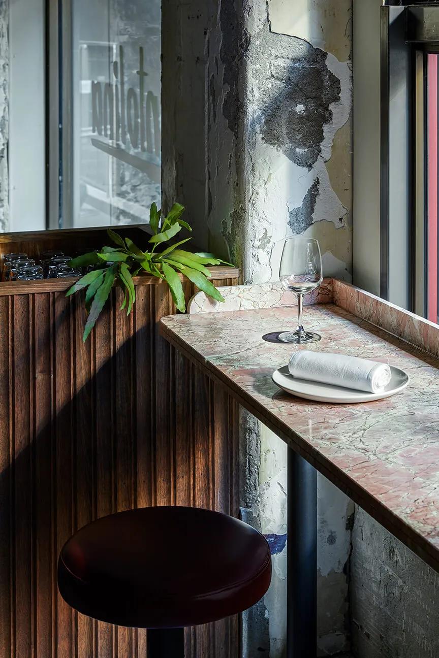 Wooden table by window in restaurant