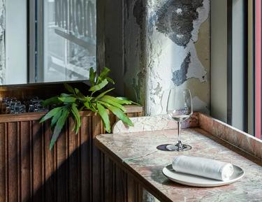 Wooden table by window in restaurant