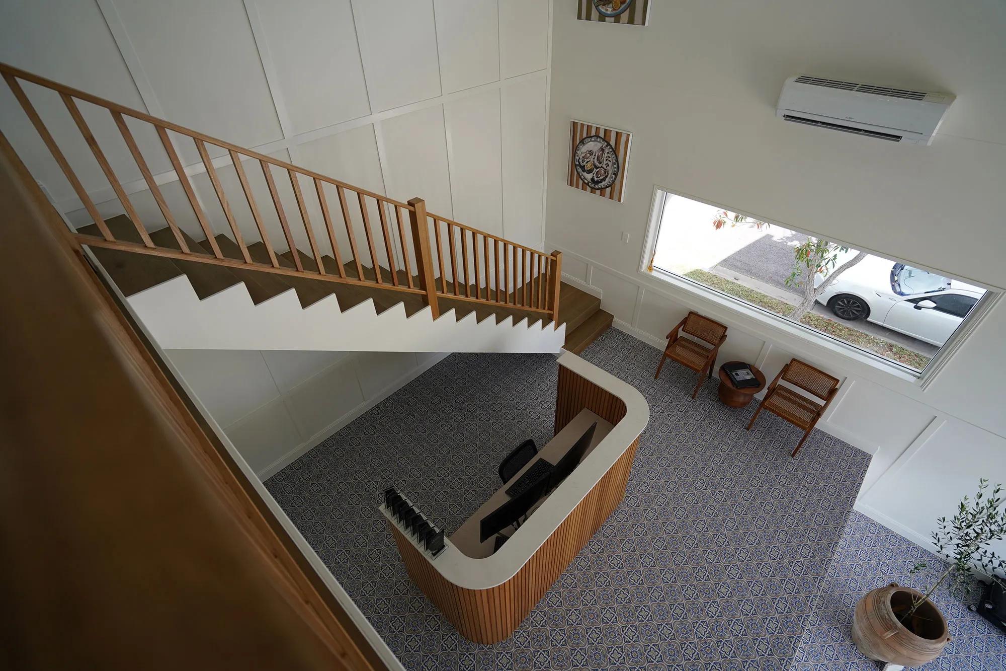 Staircase leading to an upper level in a home office setting