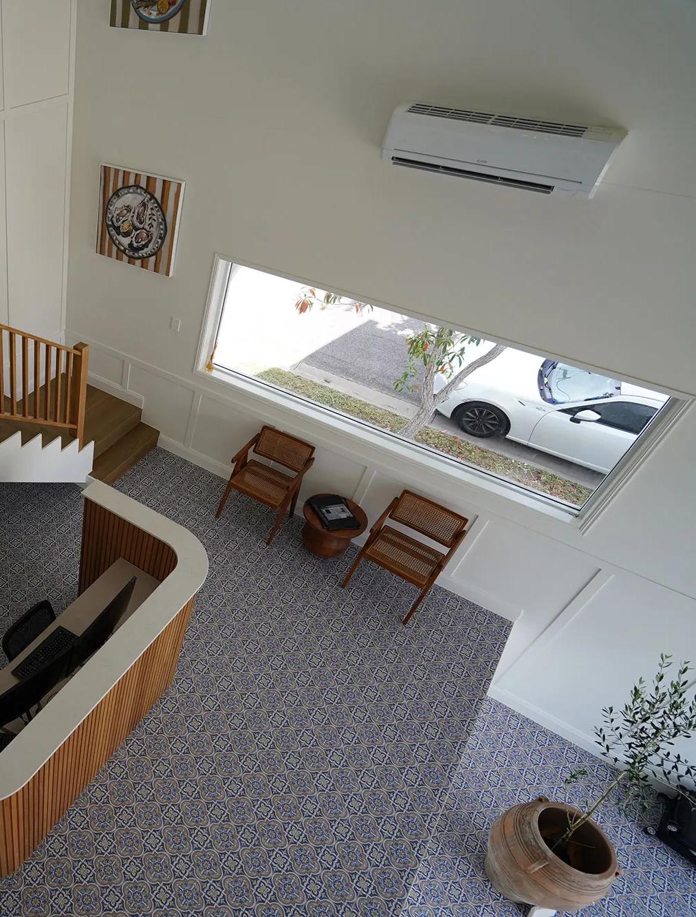 Staircase leading to an upper level in a home office setting