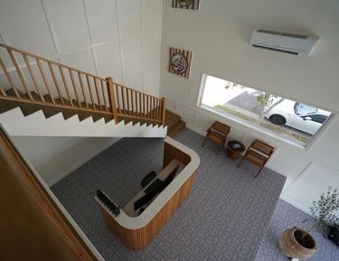Staircase leading to an upper level in a home office setting