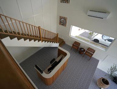 Staircase leading to an upper level in a home office setting
