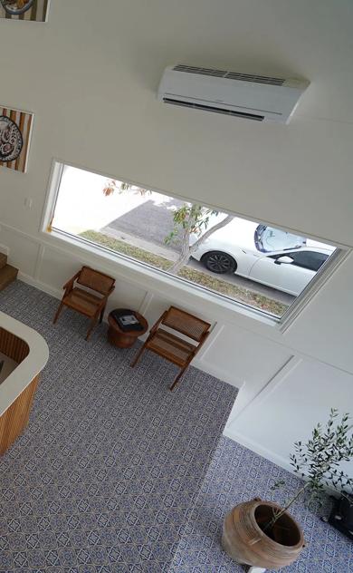Staircase leading to an upper level in a home office setting