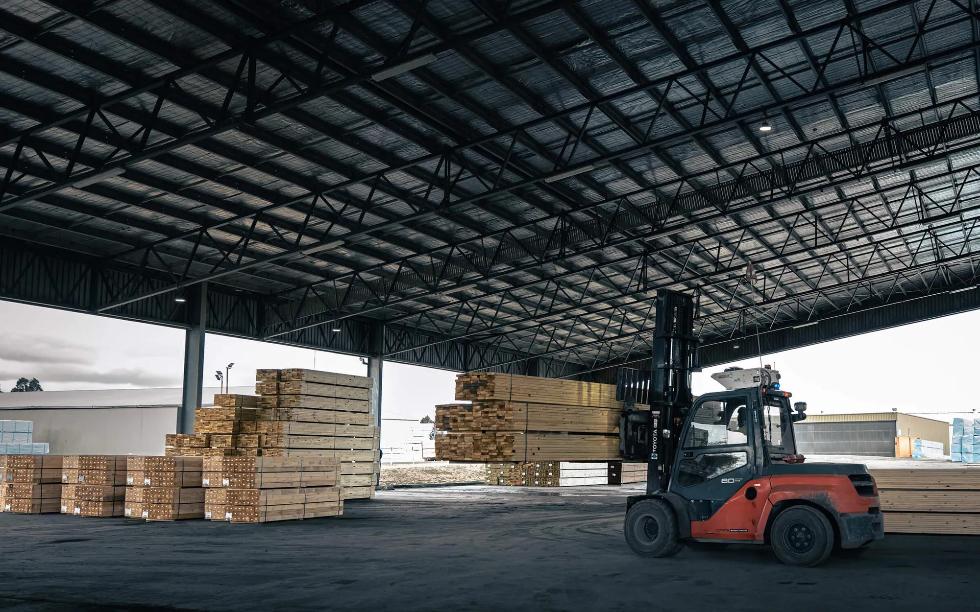 Large warehouse building with a forklift inside