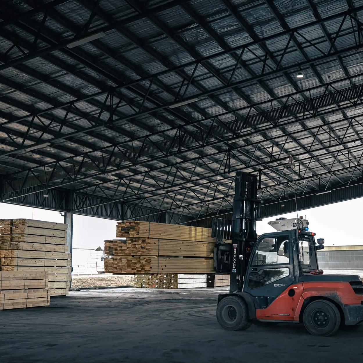 Large warehouse building with a forklift inside