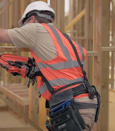 A person in a high visibility vest working on construction site