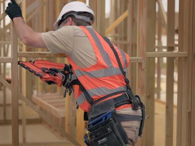A person in a high visibility vest working on construction site