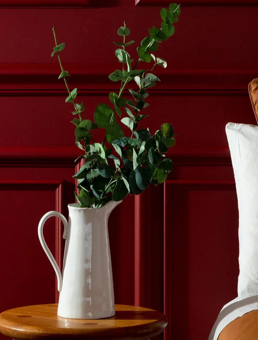 Red painted wooden paneling on wall