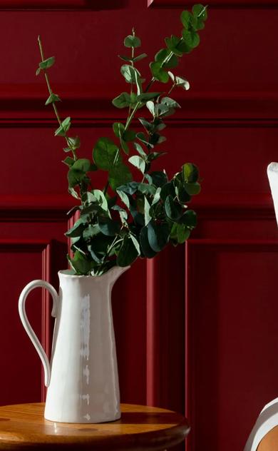 Red painted wooden paneling on wall