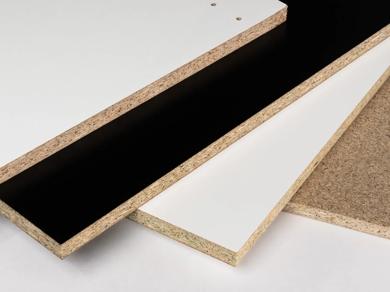 Three sheets of particleboard with visible edges