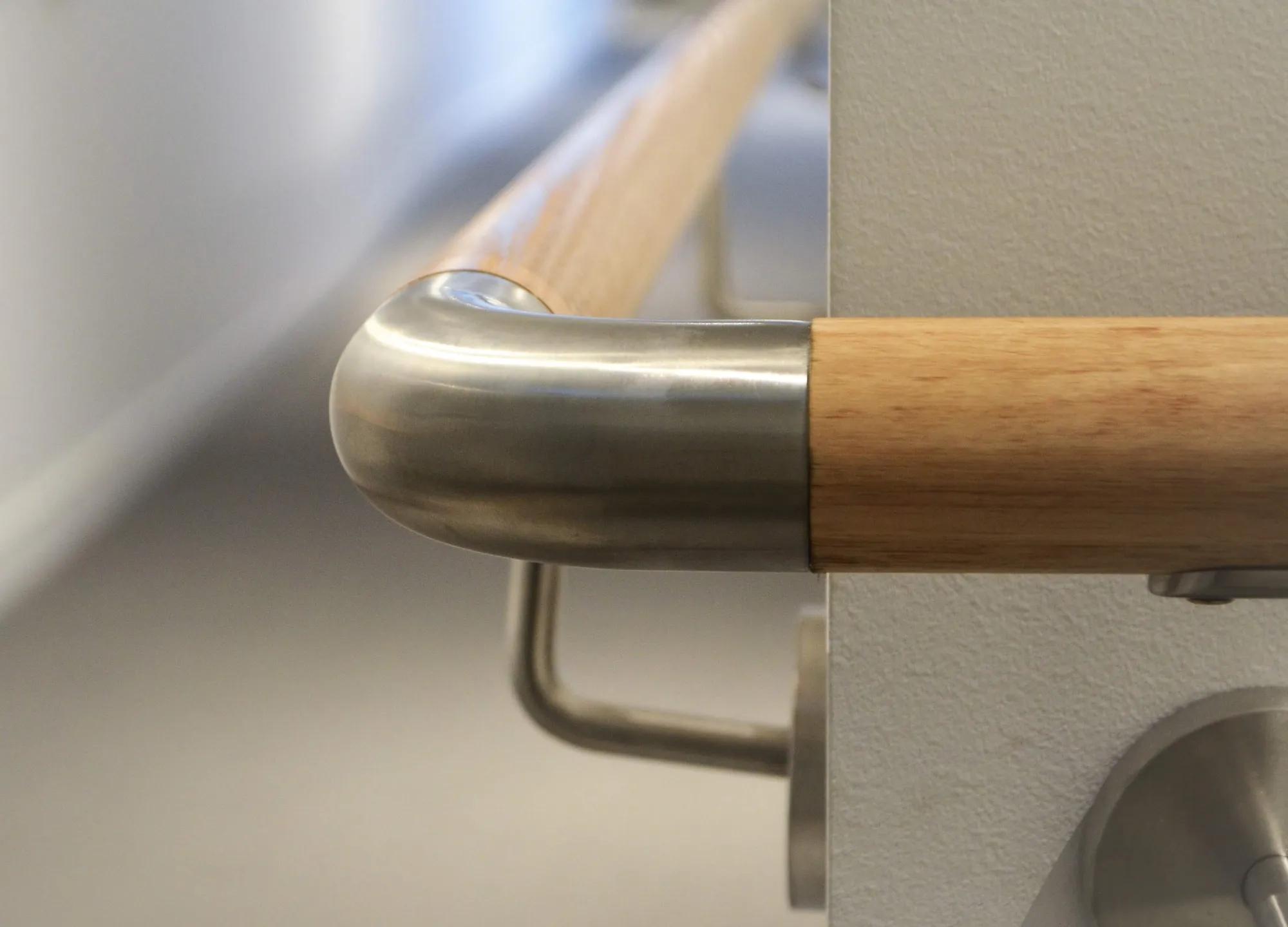 Metal adjustable bend on white railing