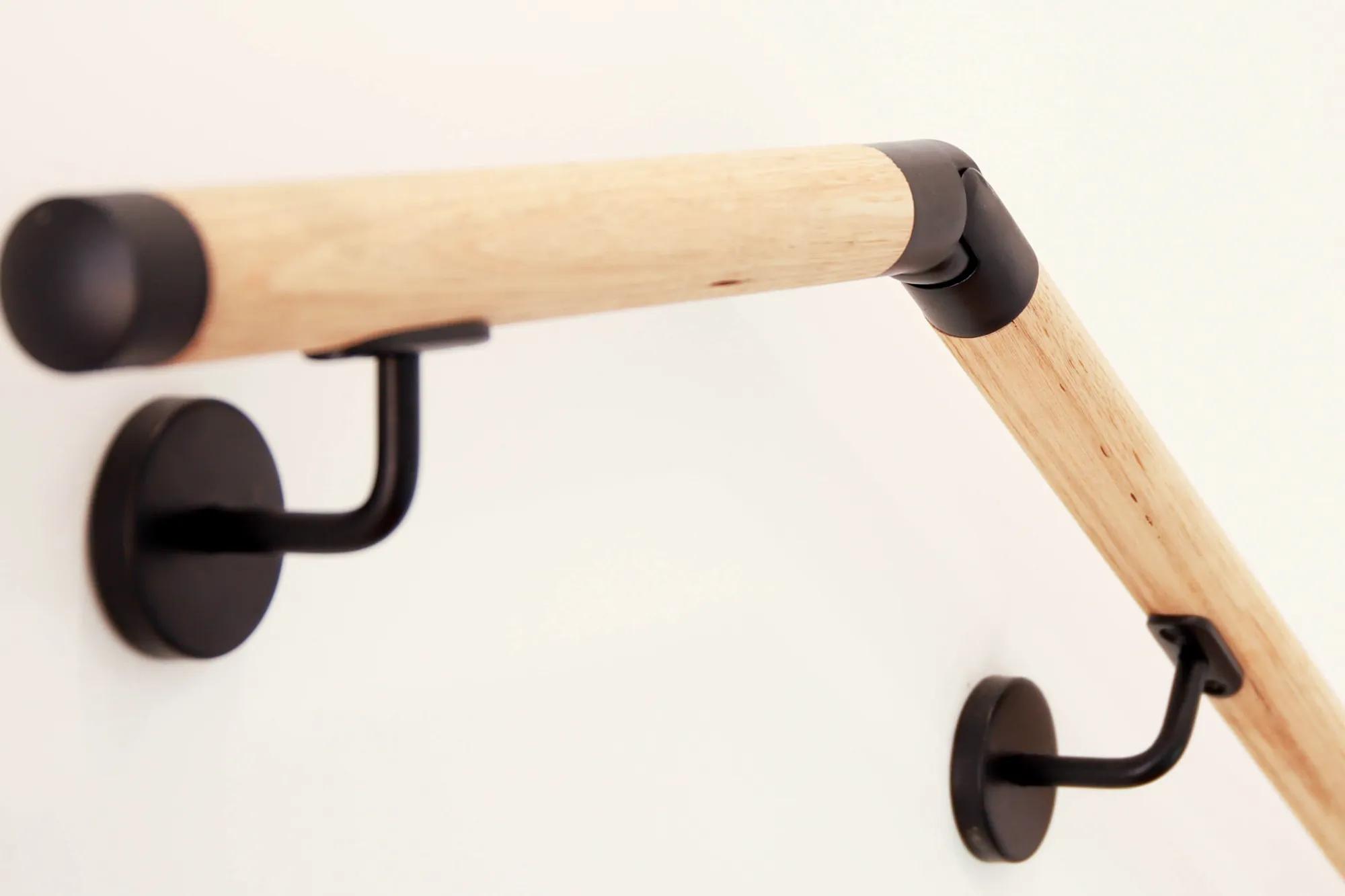 Wooden curved towel rack on wall