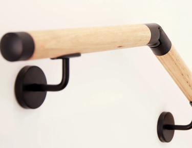 Wooden curved towel rack on wall