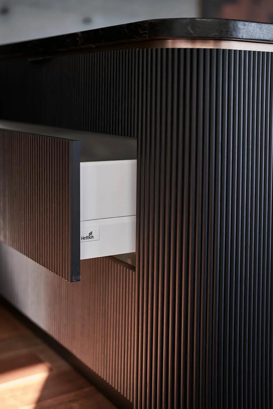 Black and brown striped wall behind counter