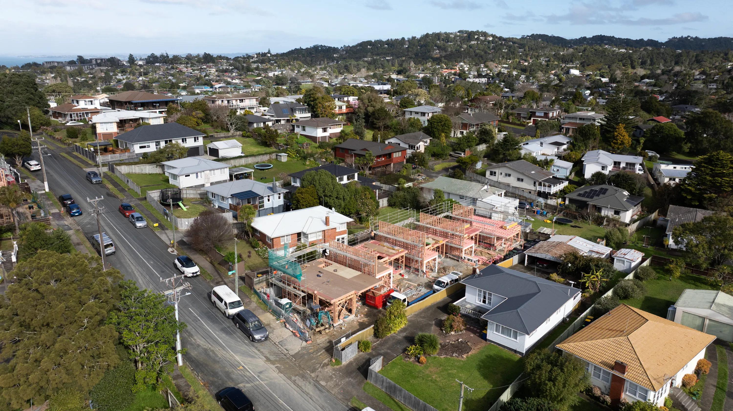Aerial view of a suburban neighbourhood with a residential house under construction