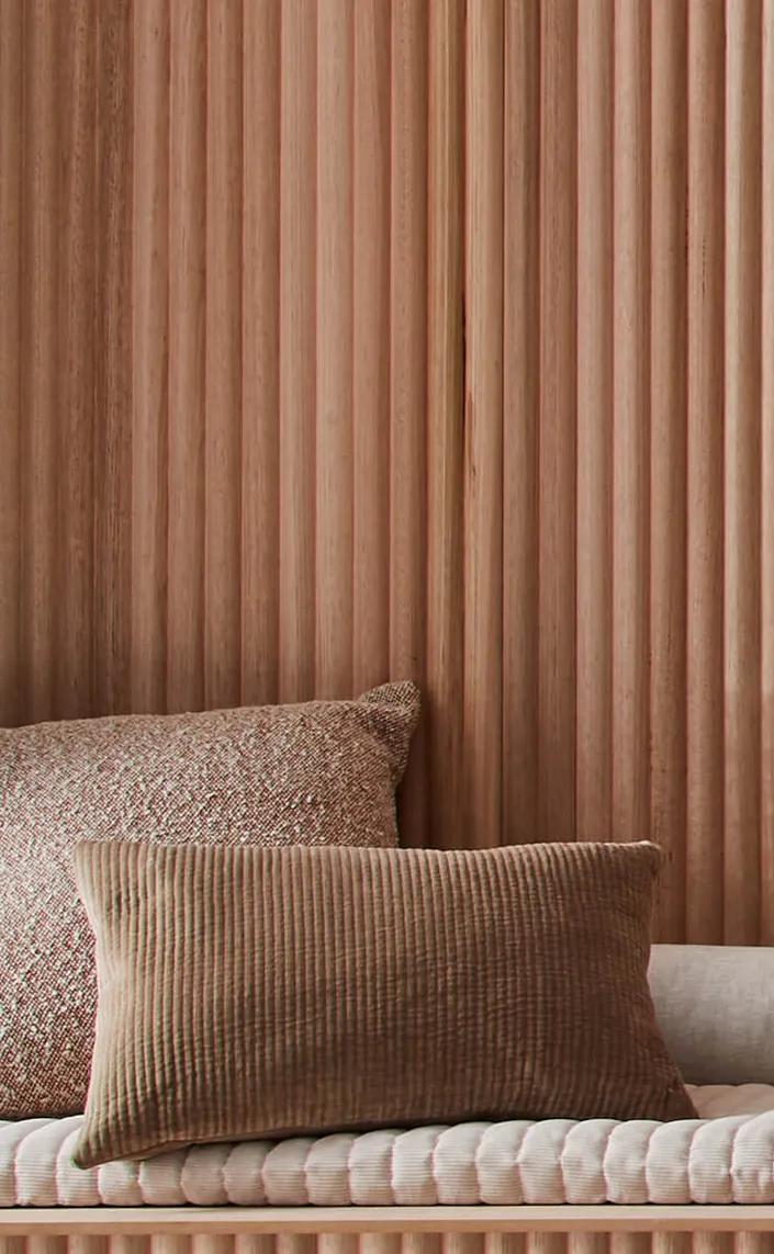 A long, brown wooden wall