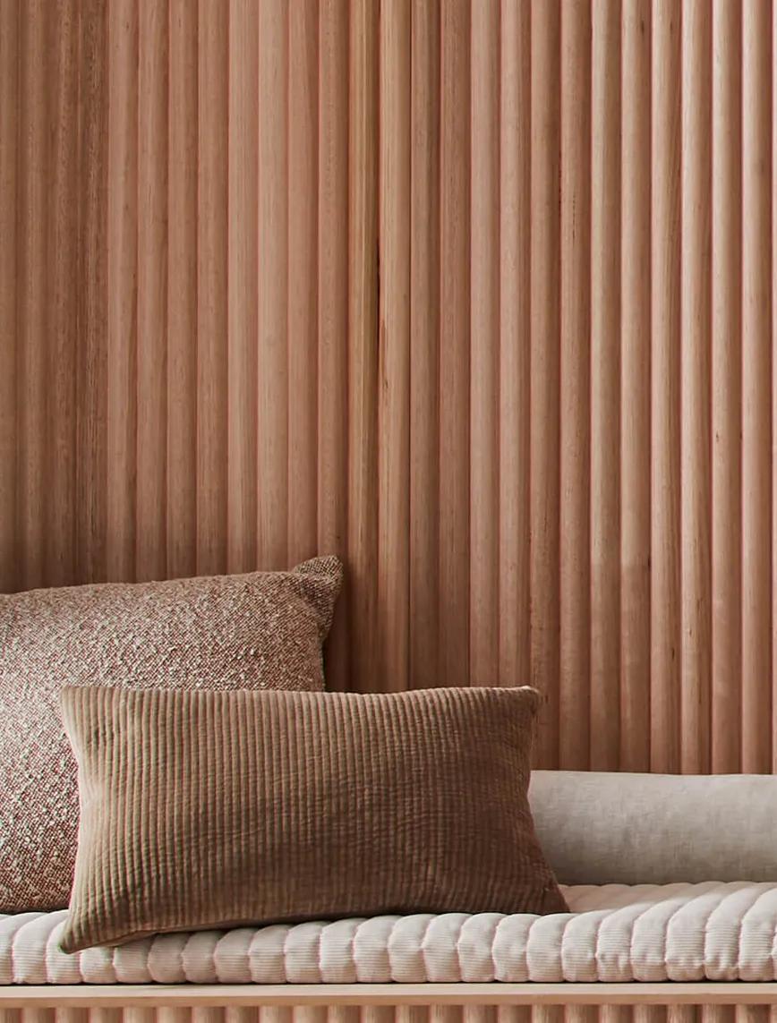 A long, brown wooden wall