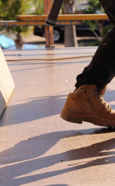 People on building site with boards and equipment
