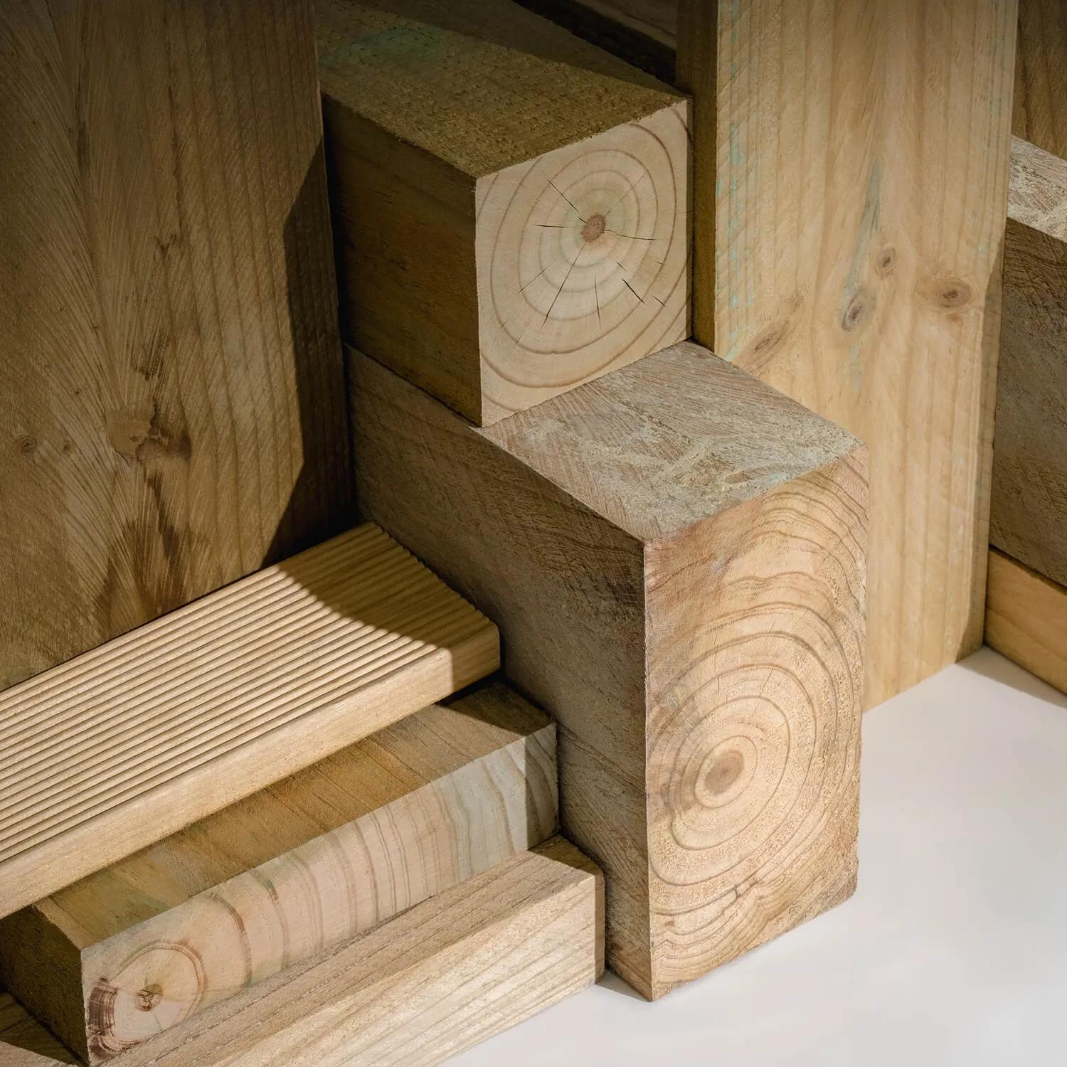 A variety of wooden construction materials stacked in a pattern