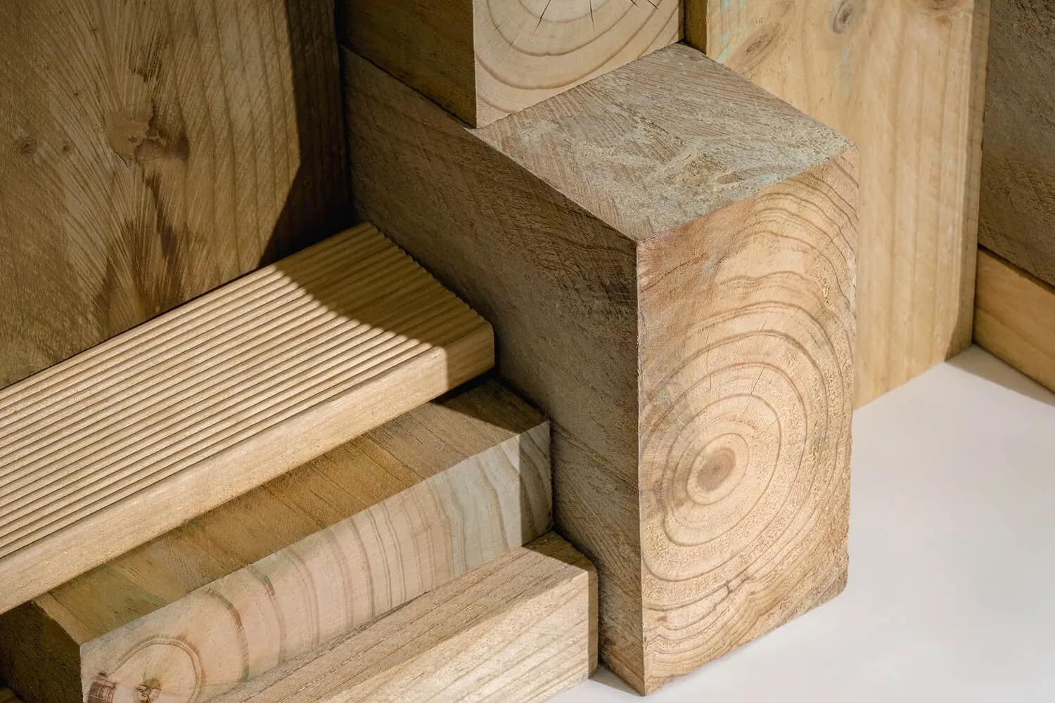 A variety of wooden construction materials stacked in a pattern