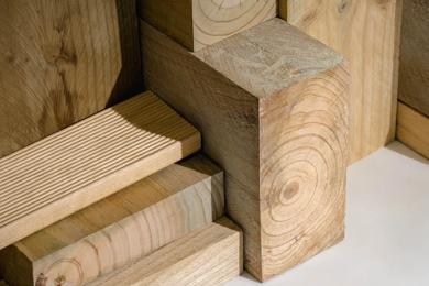 A variety of wooden construction materials stacked in a pattern