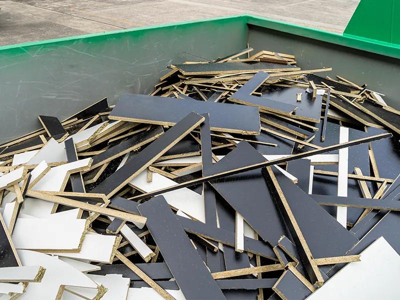 reDirect skip bin filled with melamine and particleboard offcuts.