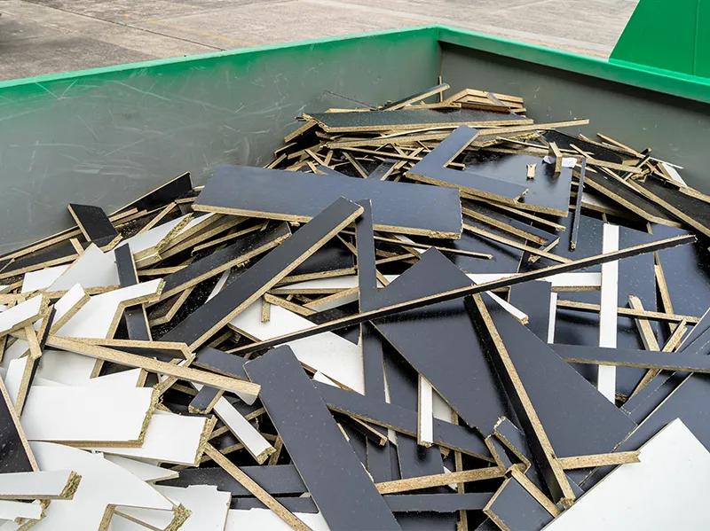 reDirect skip bin filled with melamine and particleboard offcuts.
