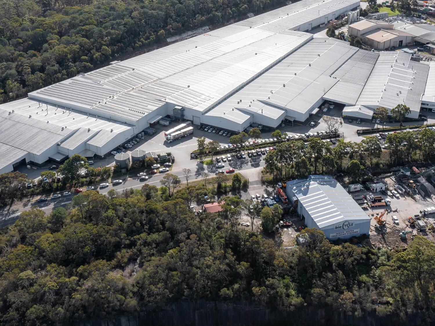 A sprawling industrial building in an Australian setting