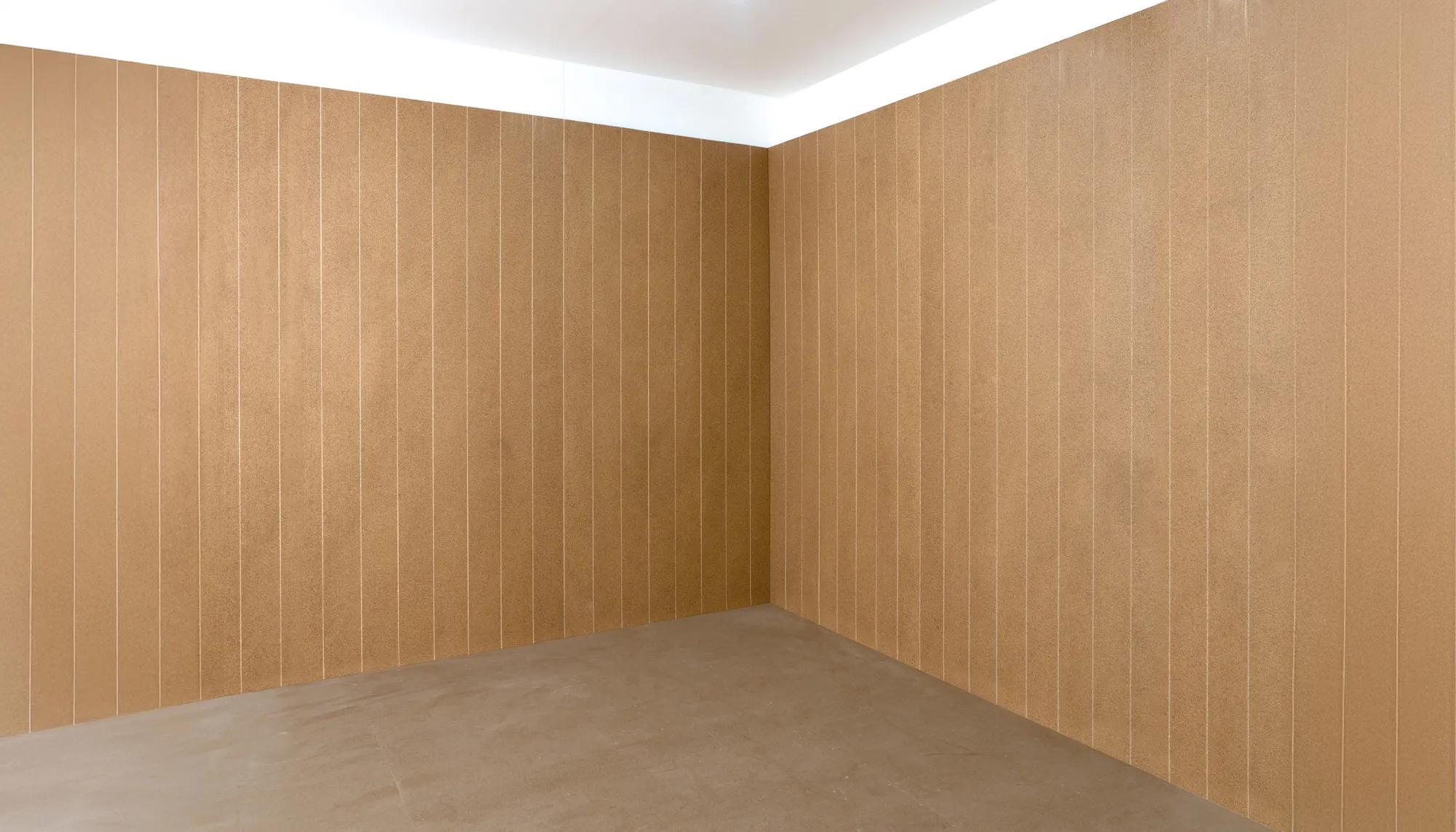 Empty room with tan wall tiles