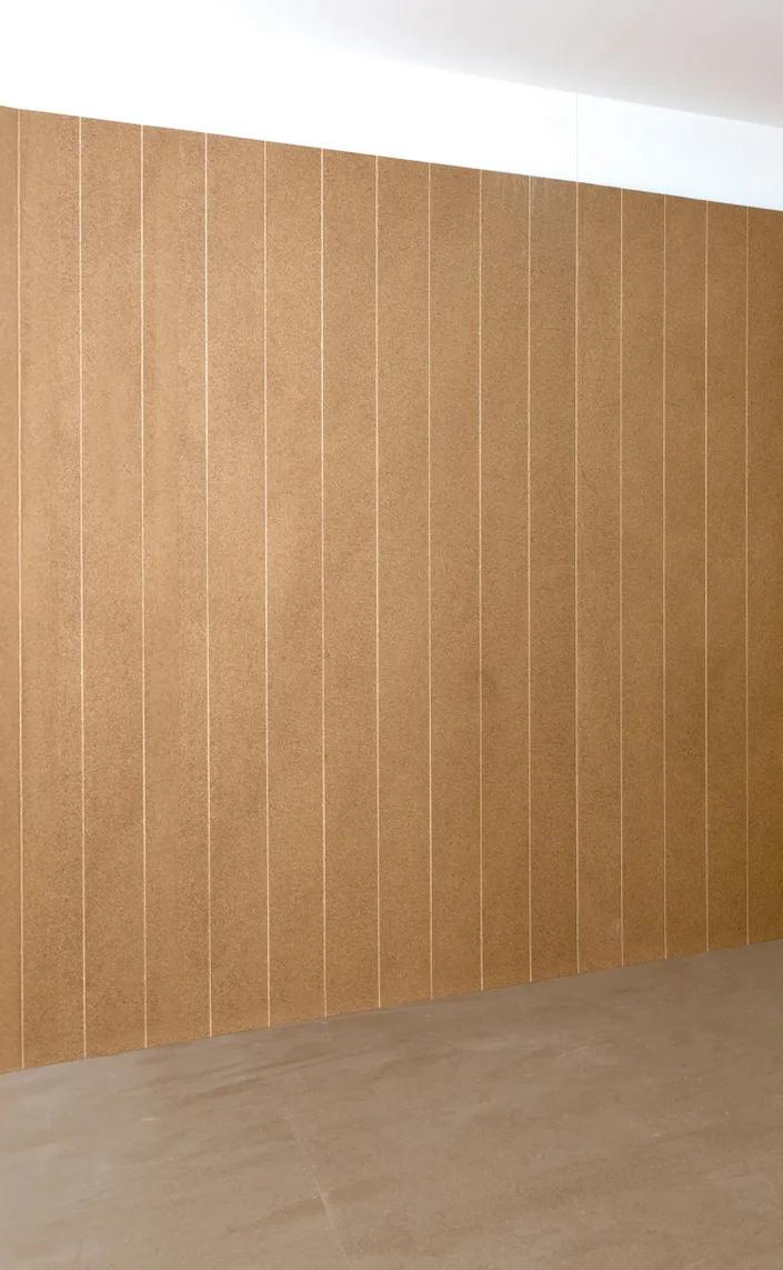 Empty room with tan wall tiles