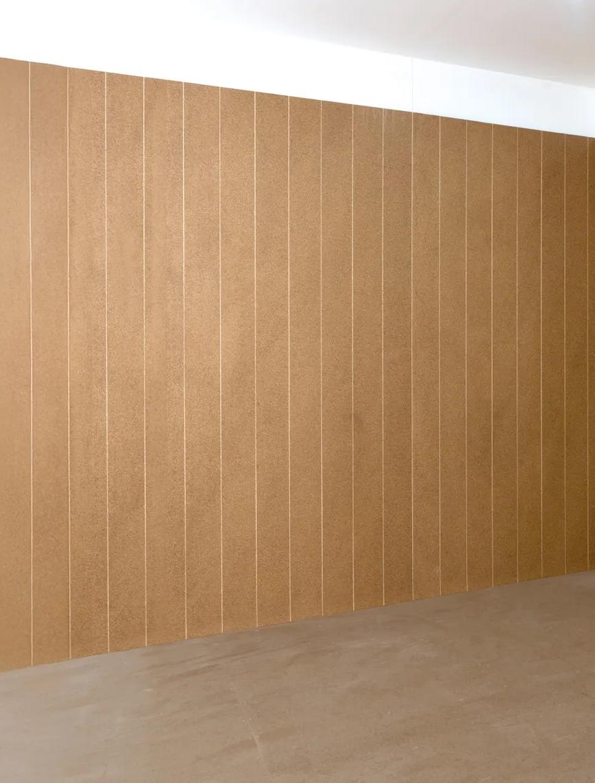 Empty room with tan wall tiles