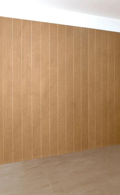Empty room with tan wall tiles
