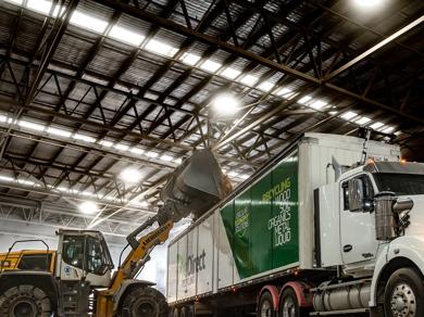 Vehicles inside a warehouse at night